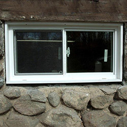 An energy efficient double-paned window installed in a basement in Camillus.