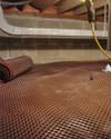Crawl space drainage matting installed in a home in Bouckville