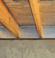 SilverGlo™ insulation installed in a floor joist in Skaneanteles Falls