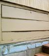 an old-fashioned crawl space door in Fayetteville about to be replaced