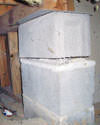 Concrete crawl space support posts in Bouckville that are showing signs of failure as they sink into the earth.