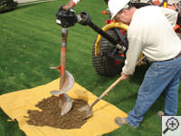 Auguring a hole in the earth for a foundation repair in Skaneanteles Falls