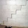 A diagonal stair step crack along the foundation wall of a Bouckville home