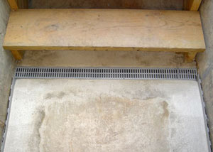 Our grated drain system installed on a leaking basement staircase in Little Falls.