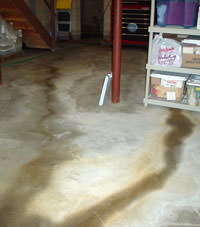 Flooding entering a basement through a floor crack in Canastota