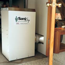 A basement dehumidifier with an ENERGY STAR® rating ducting dry air into a finished area of the basement  in Clay