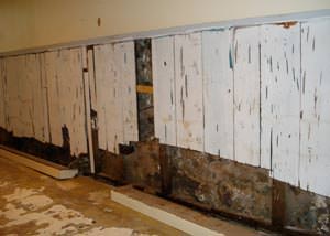 A wet, flooded finished basement in Fayetteville