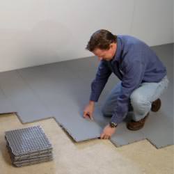 basement subfloor tiles being installed by a contractor in Union