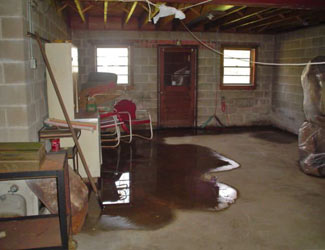 a flooded basement floor in a Clay home