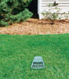 A buried gutter drain downspout extension installed in a Clay home