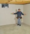 Oswego basement insulation covered by EverLast™ wall paneling, with SilverGlo™ insulation underneath