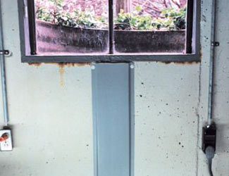 Repaired waterproofed basement window leak in Auburn